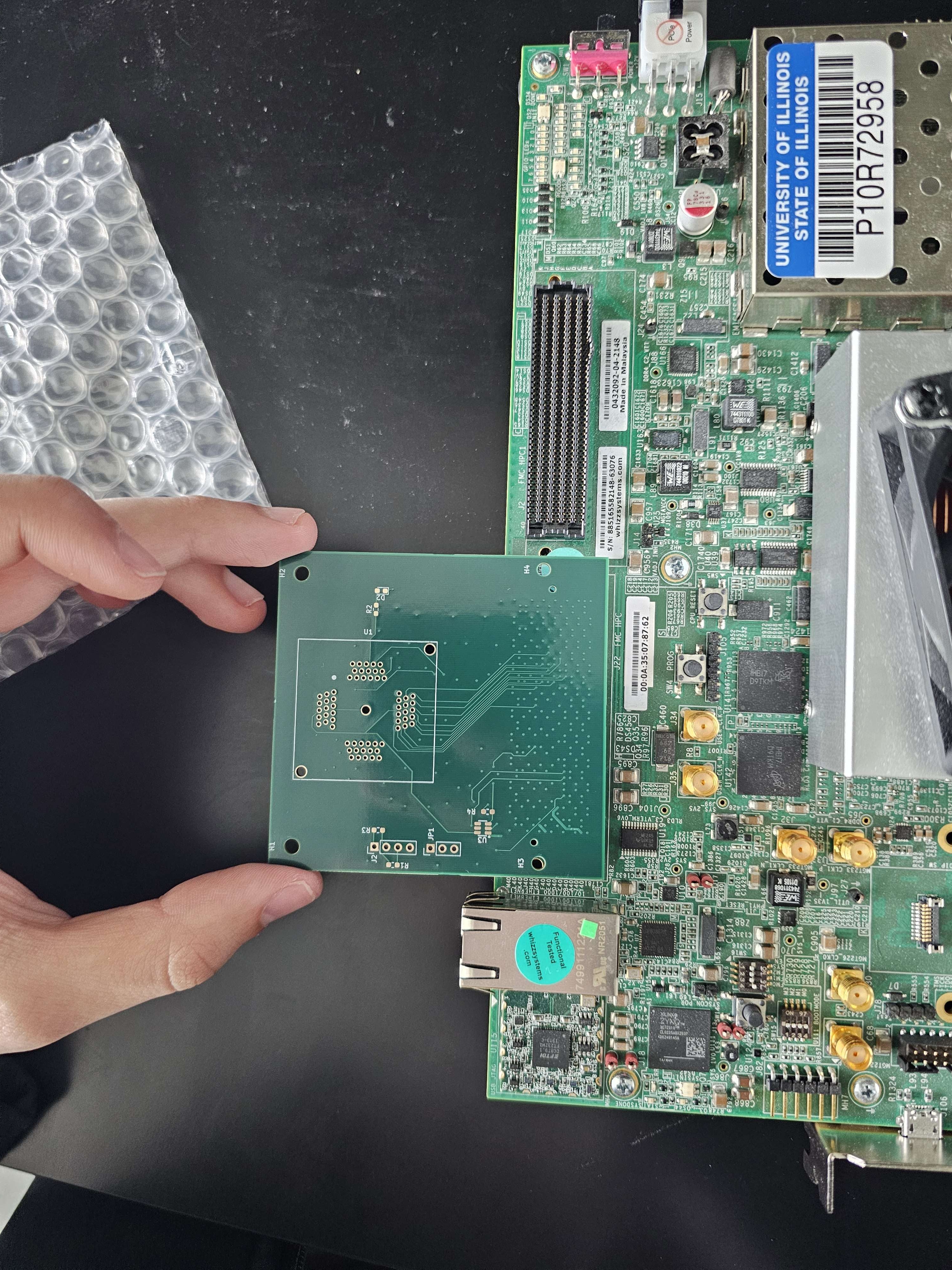 Custom PCB plugged into the VCU118
